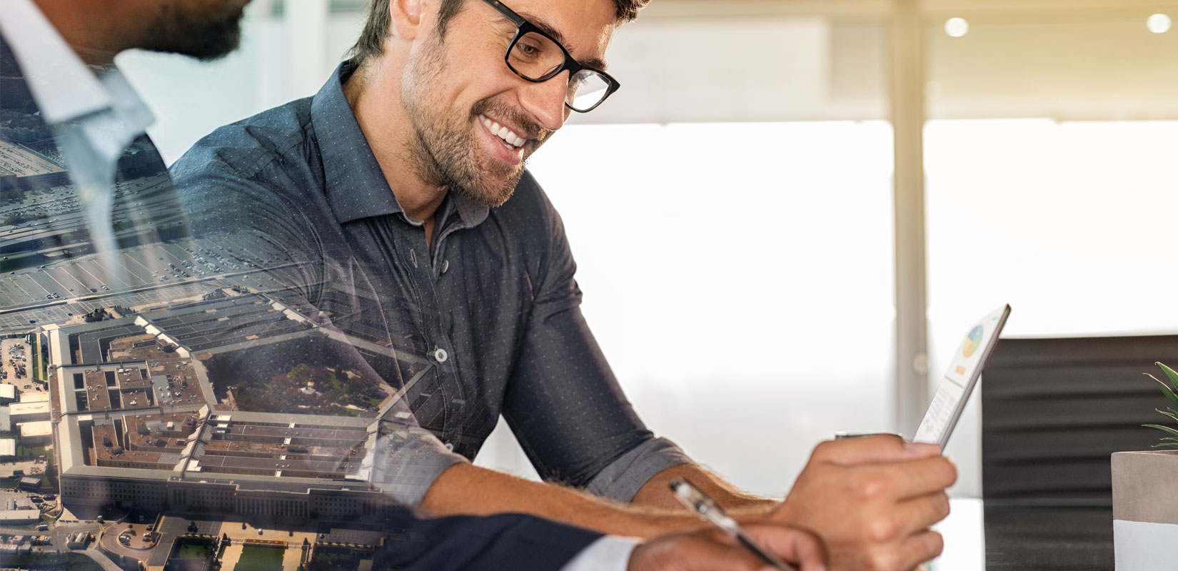 Two men looking at a computer