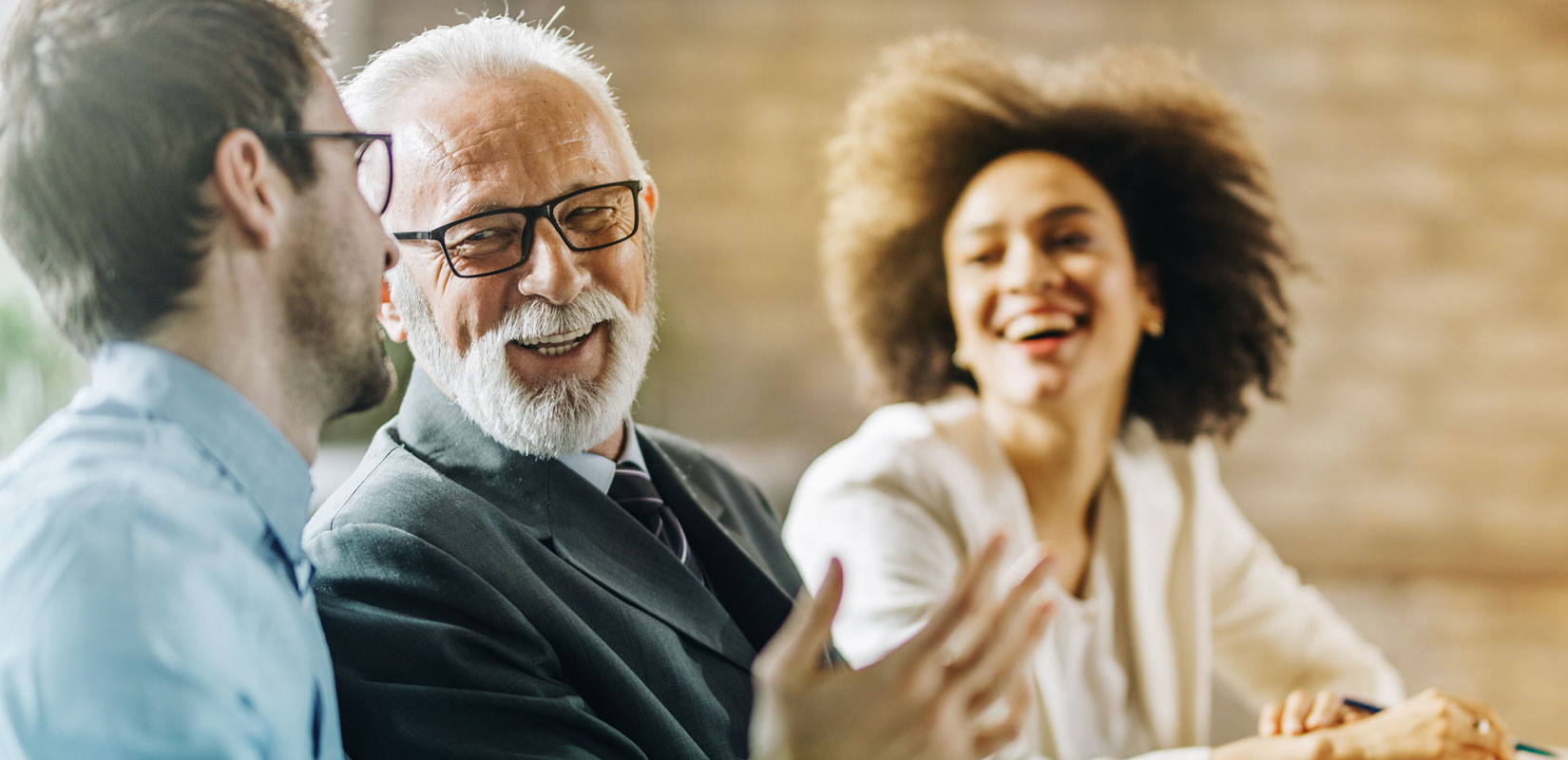 Older gentleman talking to younger persons