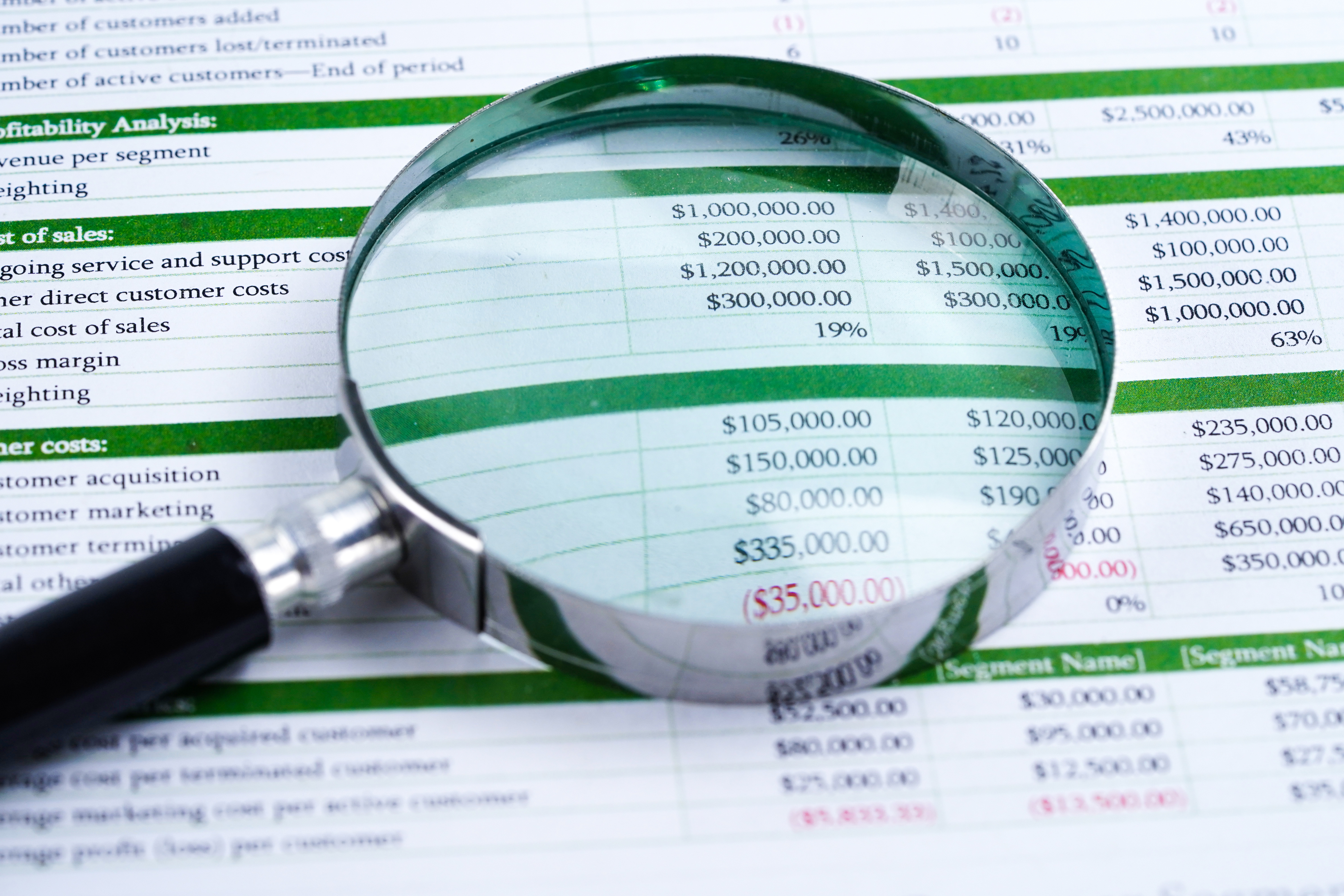 Magnifying glass over a data sheet